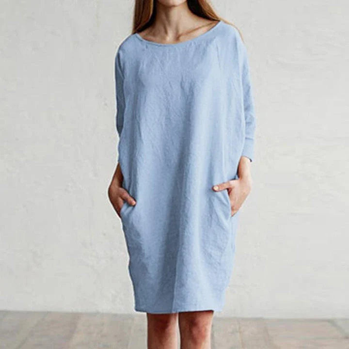 A cotton and linen dress with a round neckline, pockets, and an A-line silhouette in various colors.