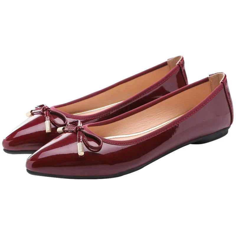 Stylish black pointed toe flats with bow knot and beading detail, perfect for Kiwi fashion