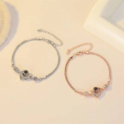 A pair of vibrant projection couple bracelets in rose gold and platinum colors