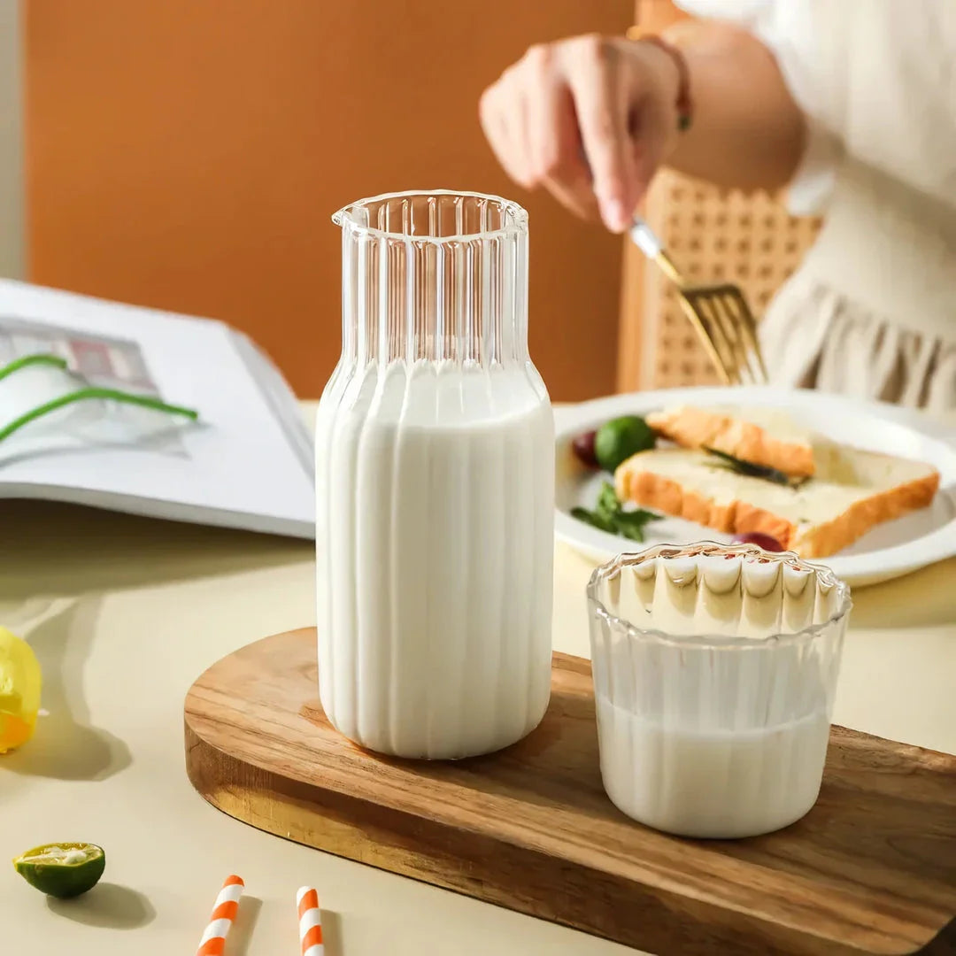 Glass water bottle and teacup set with elegant, transparent design for refreshing hydration