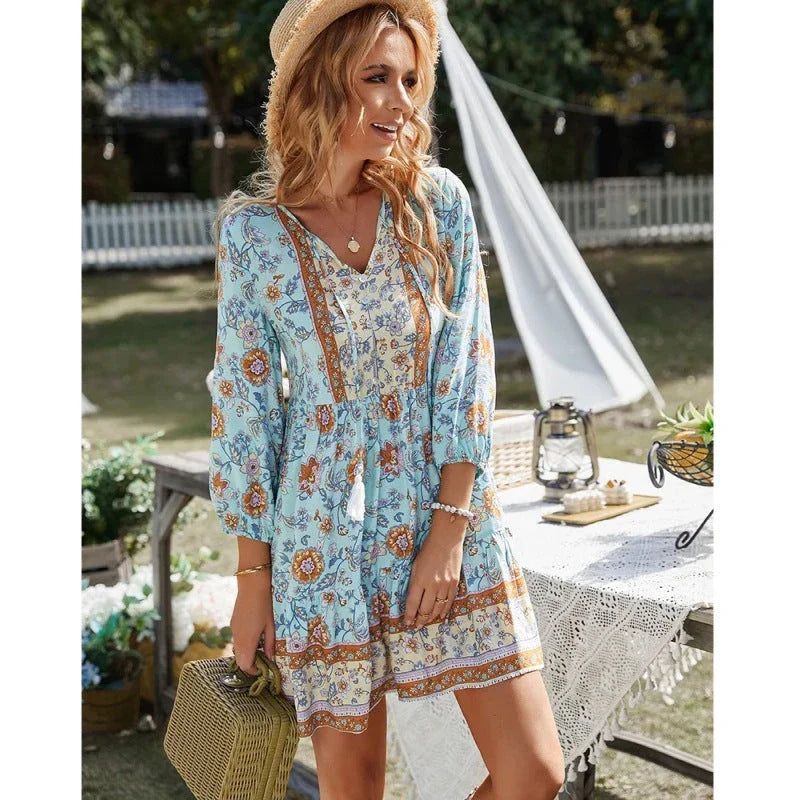 Stylish bohemian mini dress with geometric print, featuring a v-neck, three-quarter sleeves, and a flattering A-line silhouette.