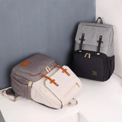 Versatile Mummy Daddy Backpack in Grey, a functional and stylish nappy bag for Kiwi families with a spacious main compartment, insulated pockets, and a USB charging port.