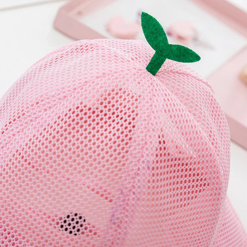 A breathable mesh bucket hat with a cute sprout design, perfect for keeping Kiwi kids cool and stylish during the summer.