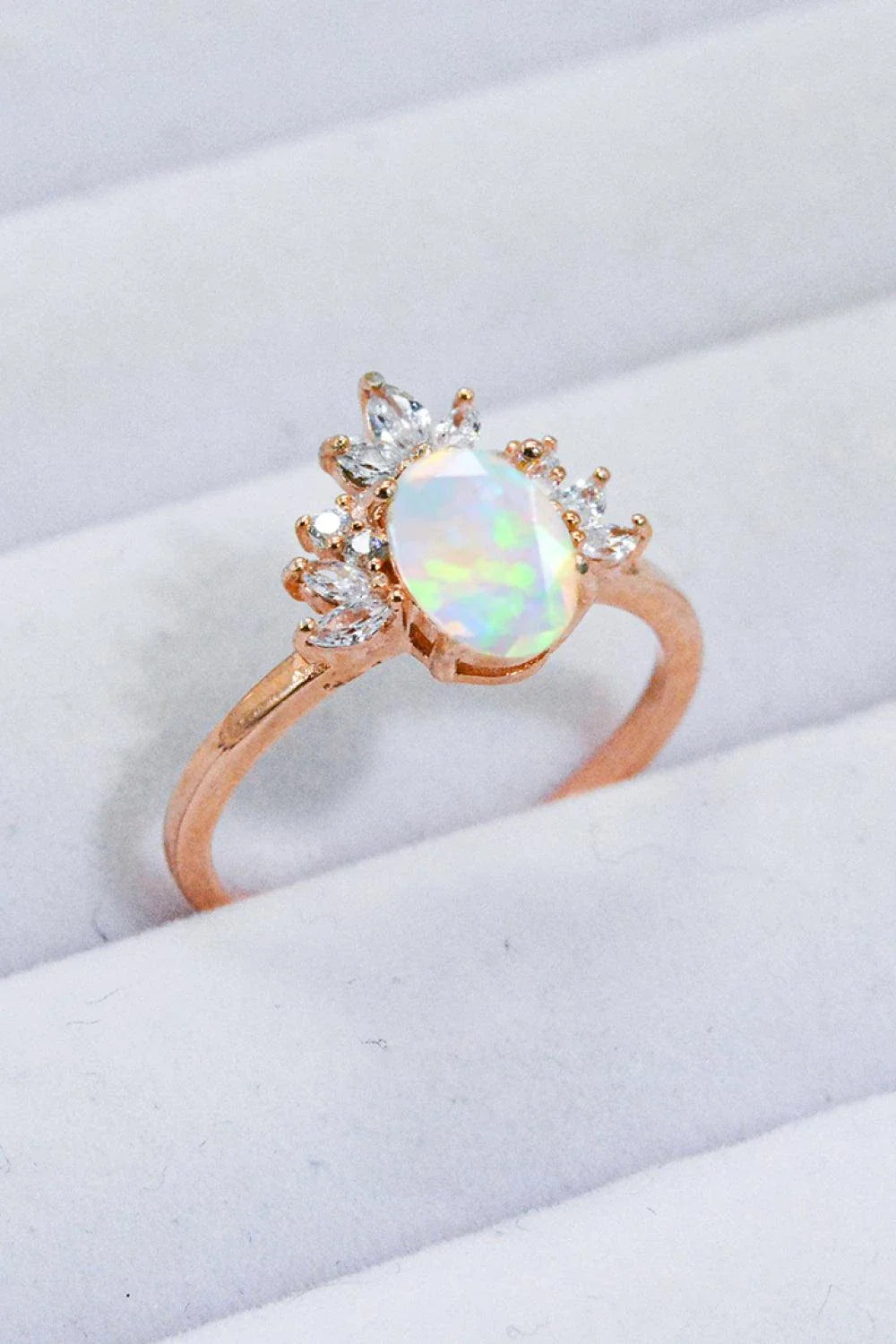 A close-up view of a 925 sterling silver ring featuring a shimmering opal stone, showcasing the modern and sustainable design.