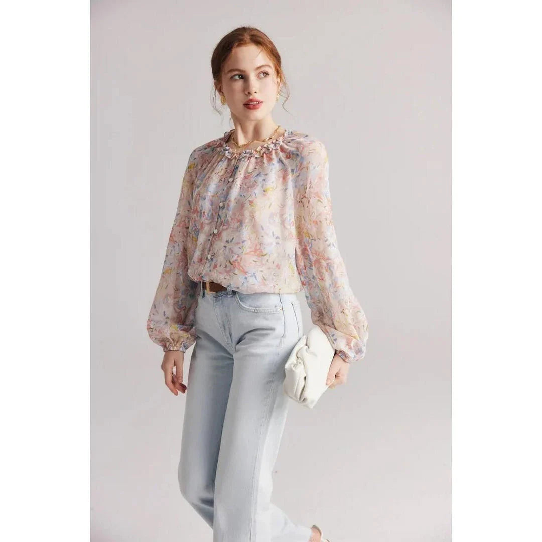 Elegant floral silk-blend blouse with ruffled details and relaxed raglan sleeves