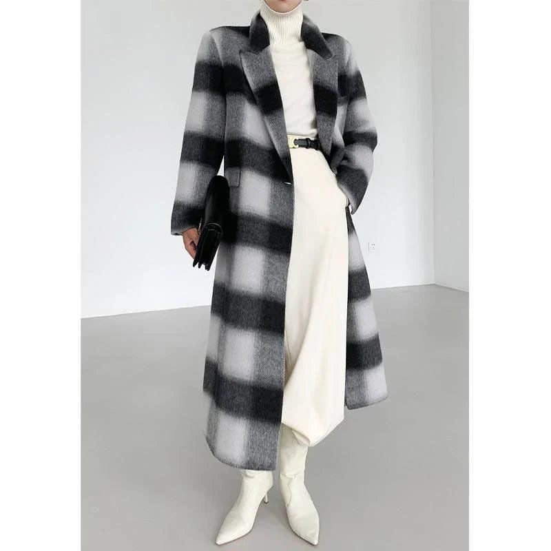 A stylish plaid double-breasted long wool coat for fashionable Kiwi women, featuring a cozy and elegant design with functional pockets and a versatile turn-down collar.