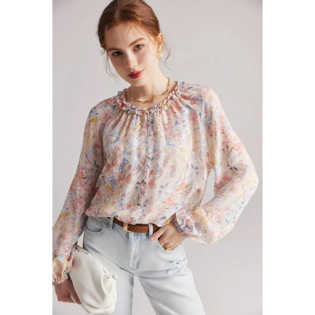 Elegant floral silk-blend blouse with ruffled details and relaxed raglan sleeves