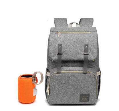 Versatile mum's backpack with pink color, featuring side pockets, zippered compartments, and stroller attachment hooks