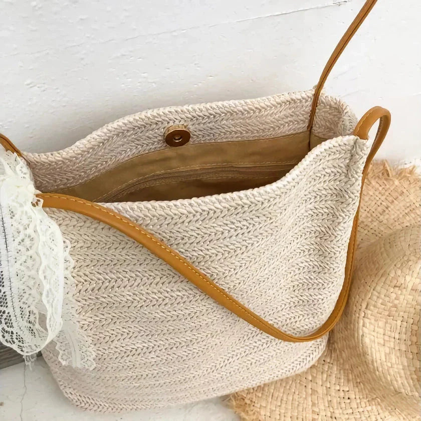 Bohemian straw woven shoulder bag in beige color, featuring a secure hasp closure and a lightweight, durable design for summer adventures.