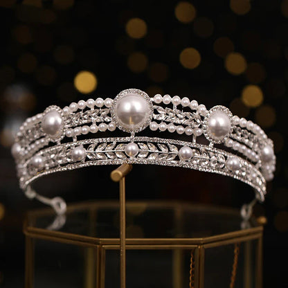 Elegant pearl crown and veil set with intricate silver or gold plated alloy design and sparkling crystal accents, perfect for a fairytale wedding day