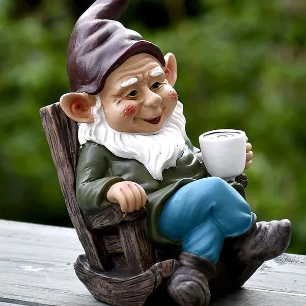 Charming outdoor gnome ornament in a rocking chair, perfect for adding whimsical personality to Kiwi gardens and patios