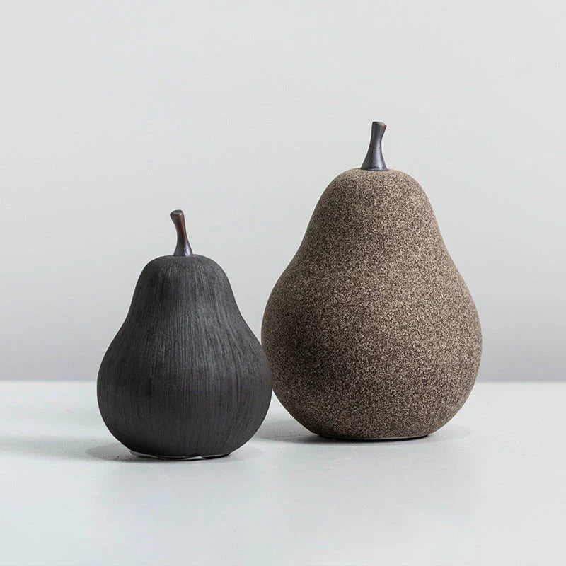 Handcrafted ceramic pear decoration with a sleek, modern design, perfect for adding a touch of natural elegance to any Kiwi home