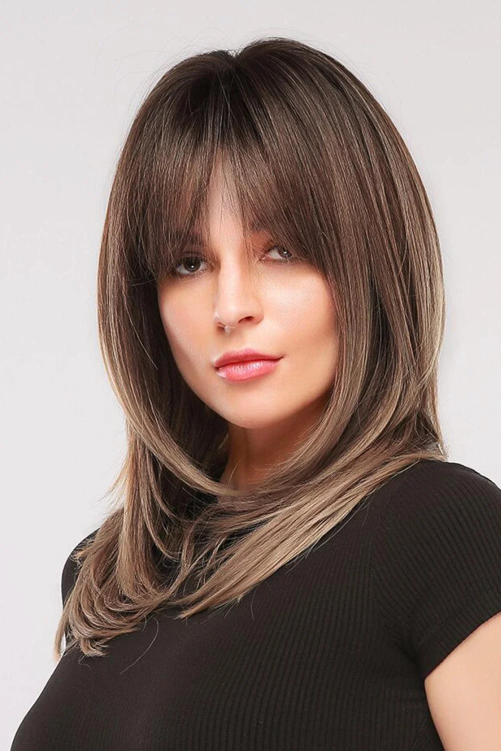 Stylish mid-length wave synthetic wig in cream color with comfortable cap construction and heat-safe synthetic fibres