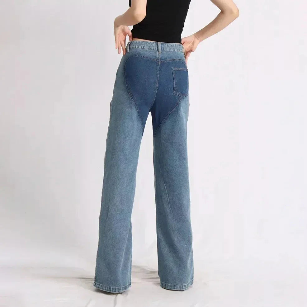 Stylish high-waist floral jeans with distressed detailing, perfect for the modern Kiwi woman's wardrobe.