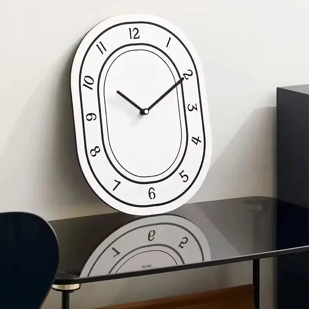 A minimalist, white wall clock with a clean design that adds a touch of modern sophistication to any Kiwi home.