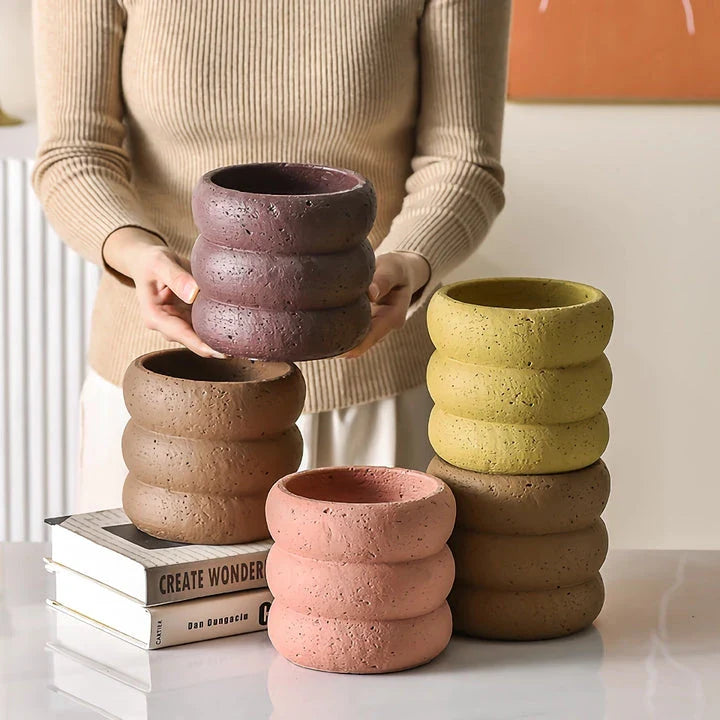 Stylish modern minimalist cement flower pots in two sizes, perfect for showcasing plants and greenery in a Kiwi home