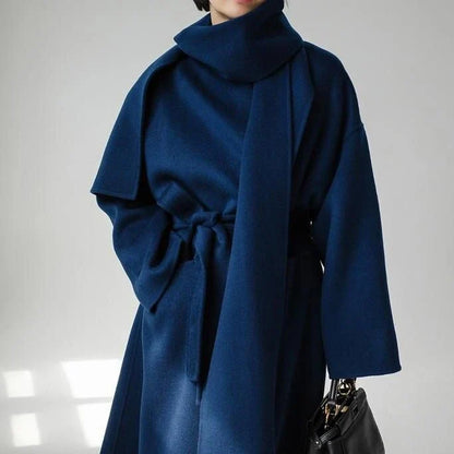 Stylish and warm New Zealand women's woollen coat in blue, featuring a chic scarf collar and relaxed fit design.