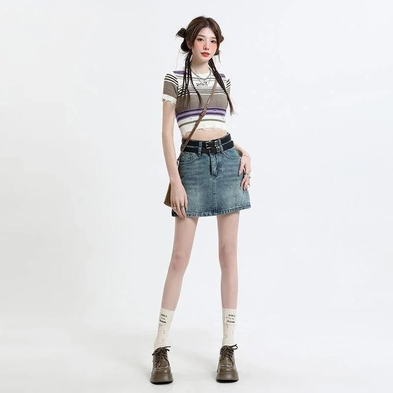 A stylish high-waisted denim mini skirt with a fashionable belt, perfect for Kiwi fashion enthusiasts