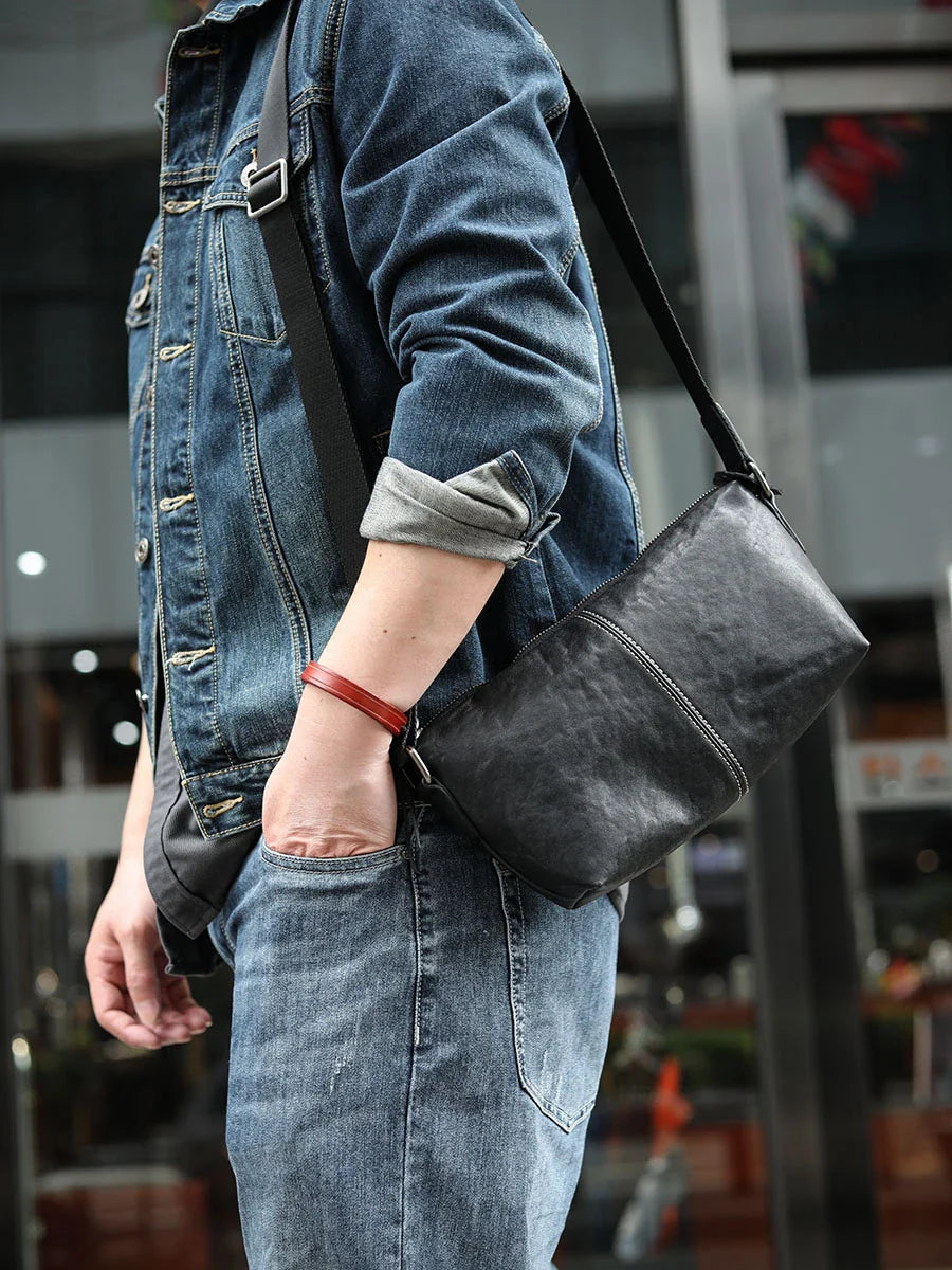 Stylish leather messenger bag with zipper closure and adjustable shoulder strap, perfect for Kiwi men's everyday carry