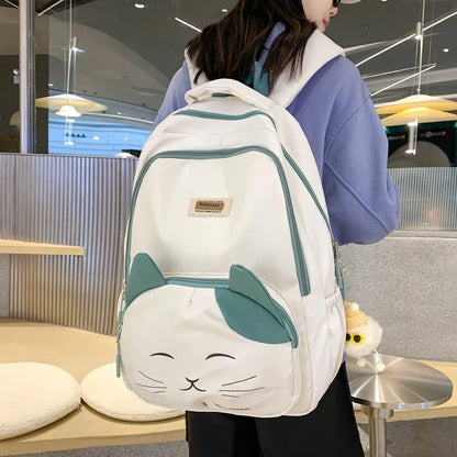 A stylish Japanese-inspired cat backpack with a large capacity, breathable nylon construction, and dedicated storage compartments for student essentials.