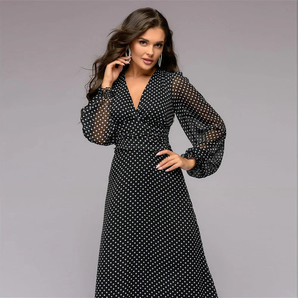 A beautiful chiffon dress featuring a timeless polka dot print, perfect for any occasion in New Zealand.