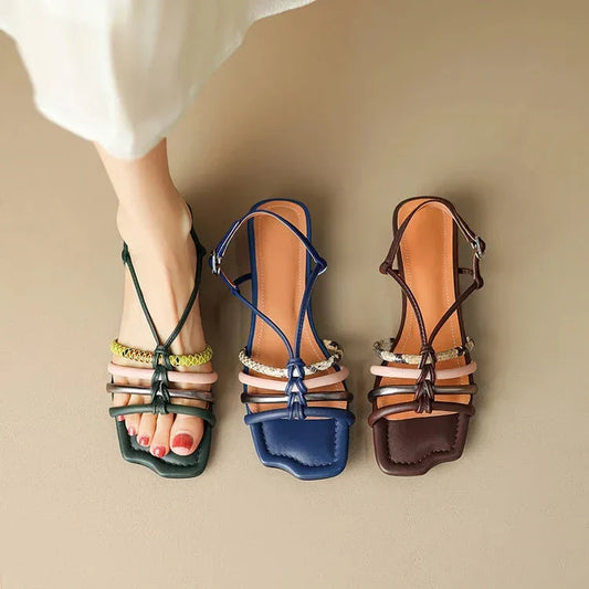 Vibrant Roman-inspired sandals with chunky heel, showcasing a stylish and comfortable summer footwear option