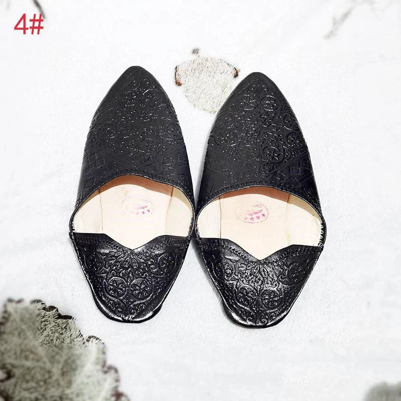 Handcrafted Moroccan leather slippers with pointed-toe design and cushioned insoles for comfort and style