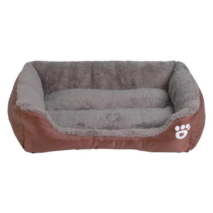 A cozy, waterproof pet bed featuring a soft fleece lining and paw print design, perfect for providing comfort and support for your beloved companion.