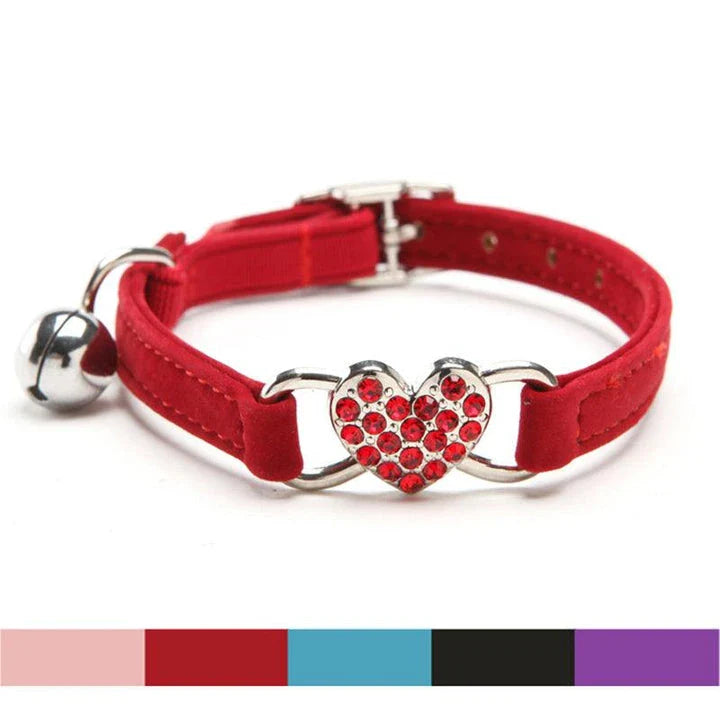 A stylish cat collar made of premium velvet material, featuring a heart-shaped charm and jingle bell for a playful touch.