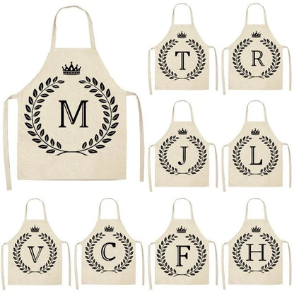 A crown and letter printed kitchen apron made of high-quality cotton and linen, suitable for both men and women in New Zealand kitchens.