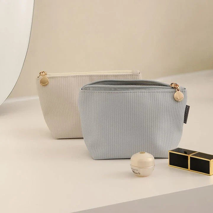 Compact and versatile mini cosmetic pouch in beige and gray colours, perfect for New Zealand travellers