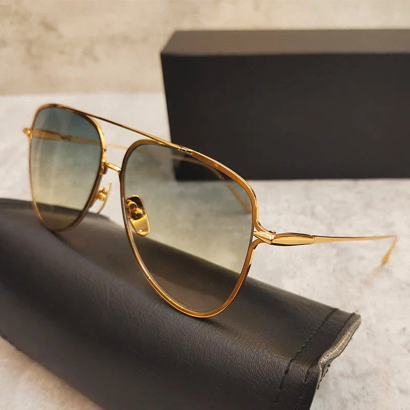 Premium pure titanium pilot sunglasses with a luxurious gold finish, offering superior UV protection and timeless vintage-inspired design.