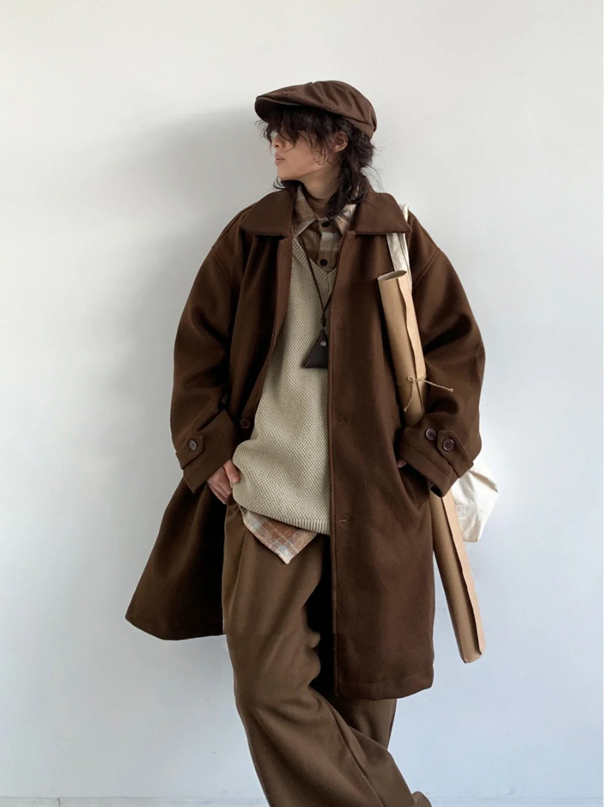 Premium woollen coat in a retro Japanese-inspired style, with a relaxed fit and earthy tones perfect for the Kiwi winter.