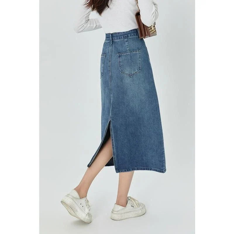A stylish blue A-line midi denim skirt with a flattering empire waistline, perfect for the modern Kiwi woman's wardrobe