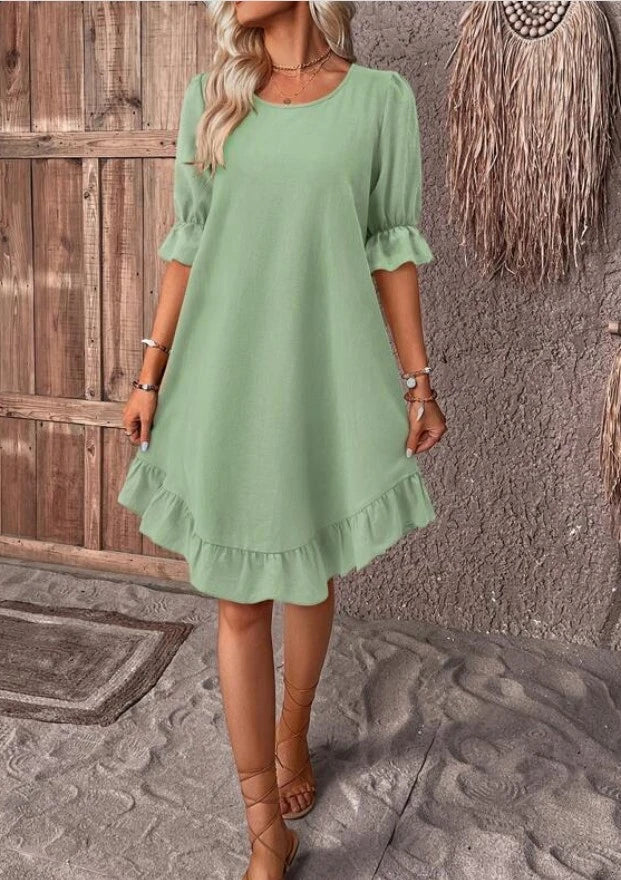 Stylish ruffle dress in a variety of colors, featuring a relaxed, straight silhouette and delicate ruffles for a touch of feminine flair.