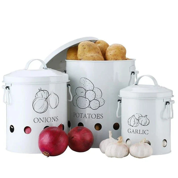 Breathable metal storage bins with handles for storing fresh produce like onions, potatoes and garlic in the kitchen.