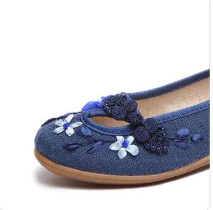 Trendha's Floral Buckle Low-top Shoes in various colors, showcasing a stylish suede upper and durable rubber sole for comfortable everyday wear.