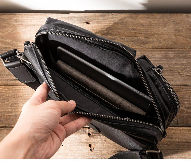 Stylish New Zealand-made leather shoulder bag in black for men, featuring a spacious design and adjustable strap for everyday use.