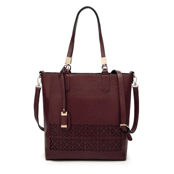 Stylish hollow handbag with adjustable straps, multiple interior pockets, and a durable PU leather construction