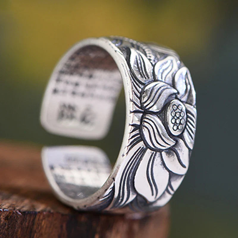 Vintage-style silver-plated Buddhism-inspired ring with lotus flower and Heart Sutra engraving, adjustable size for comfortable fit