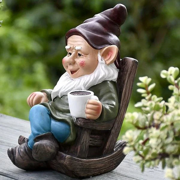 Charming outdoor gnome ornament in a rocking chair, perfect for adding whimsical personality to Kiwi gardens and patios