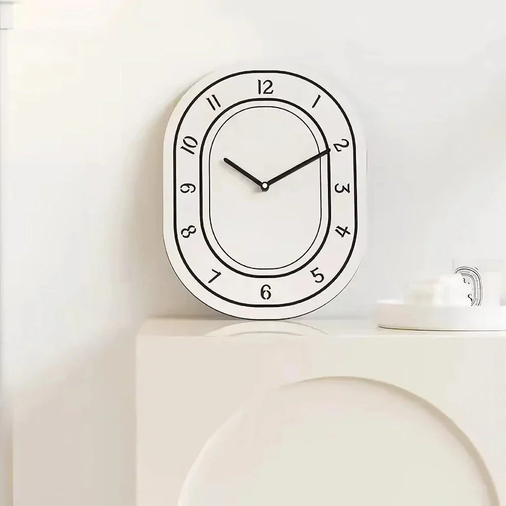 A minimalist, white wall clock with a clean design that adds a touch of modern sophistication to any Kiwi home.