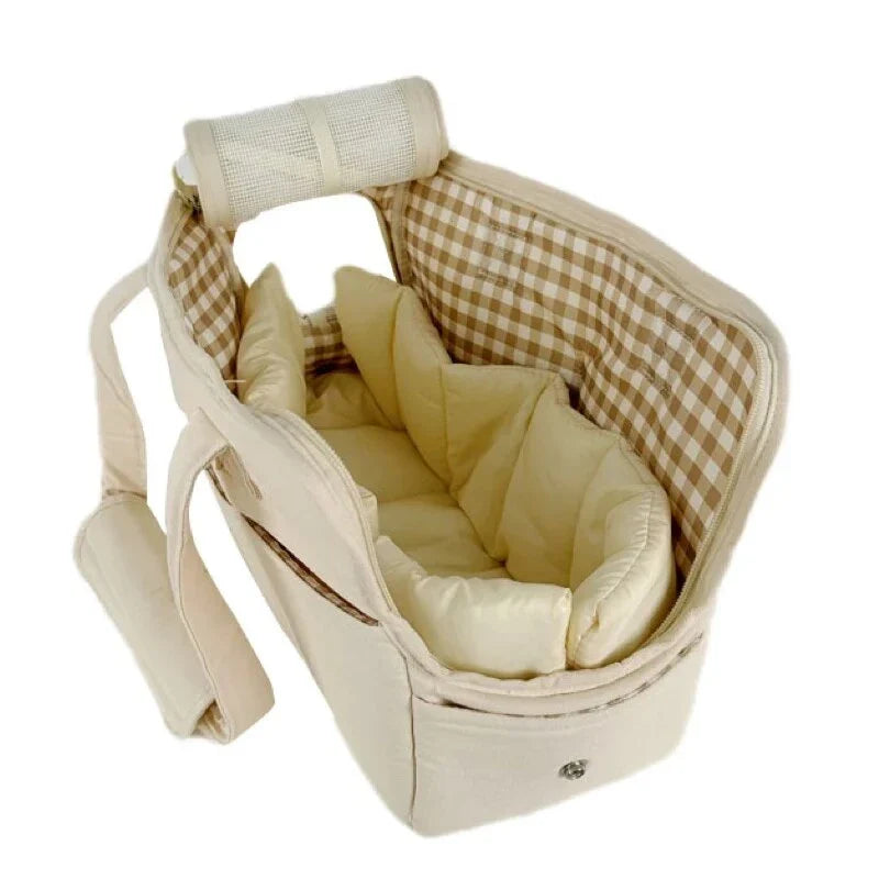 A stylish and practical cotton shoulder bag carrier for small dogs, with a hard board base and cozy interior for comfort and security during adventures.