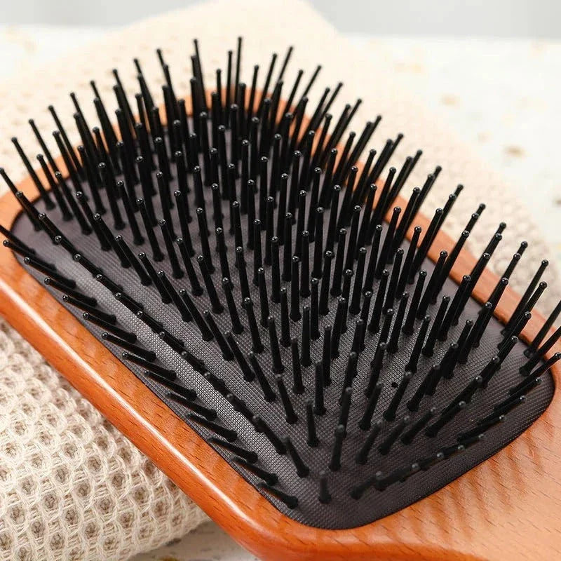 Anti-static wooden air cushion hair brush with scalp-massaging action, designed for healthy, beautiful hair