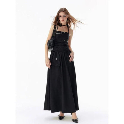 Elegant black backless maxi dress with pockets, perfect for formal events or casual outings.