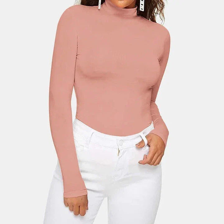 A cosy and stylish turtleneck top in a classic solid colour, perfect for layering and staying warm during the Kiwi autumn and winter seasons.