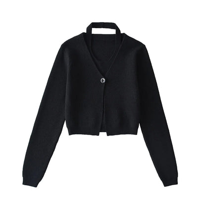 Stylish knitwear vest in a classic black or neutral colour, featuring a V-neck collar and long sleeves for a polished, versatile look.