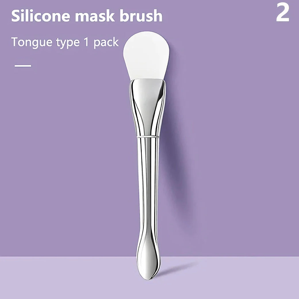A soft, flexible silicone makeup and mask brush with a durable plastic handle, perfect for precise, mess-free application of facial products.