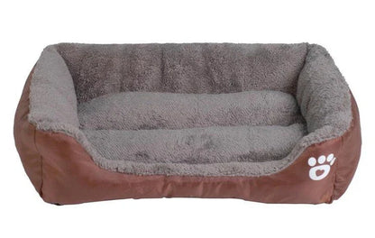 A cozy, waterproof pet bed featuring a soft fleece lining and paw print design, perfect for providing comfort and support for your beloved companion.