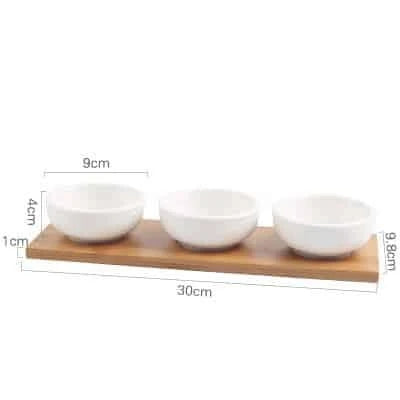 Stylish ceramic snack trays with natural wood pallet, perfect for serving nibbles and entertaining in Kiwi-style homes